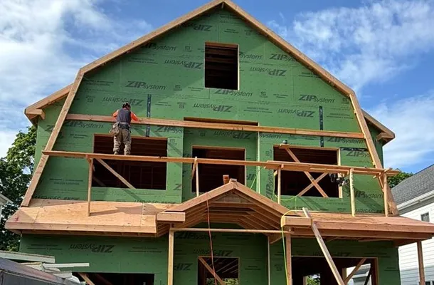 New-construction home framed and wrapped in green ZIP System sheathing by North Valley Exteriors